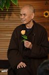 Thich Nhat Hanh and flower.jpg